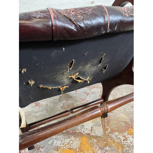 163 - A mahogany and oxblood leather Chesterfield slipper chair