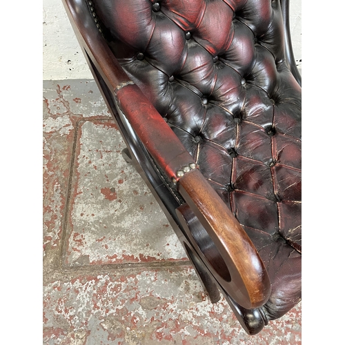 164 - A mahogany and oxblood leather Chesterfield slipper chair