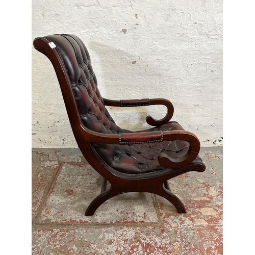 164 - A mahogany and oxblood leather Chesterfield slipper chair