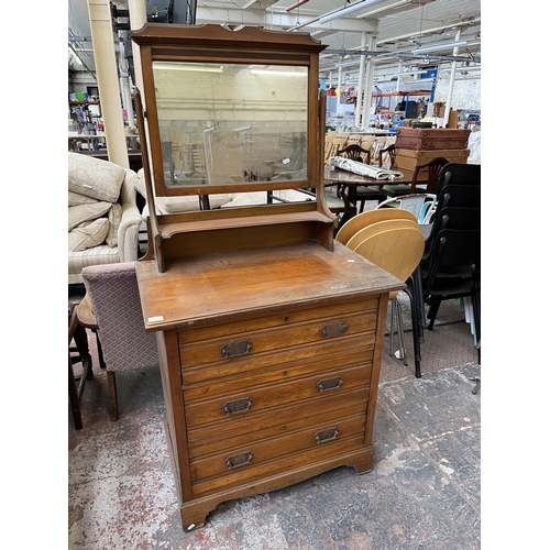 165 - An Edwardian satinwood dressing chest with three drawers and upper mirror