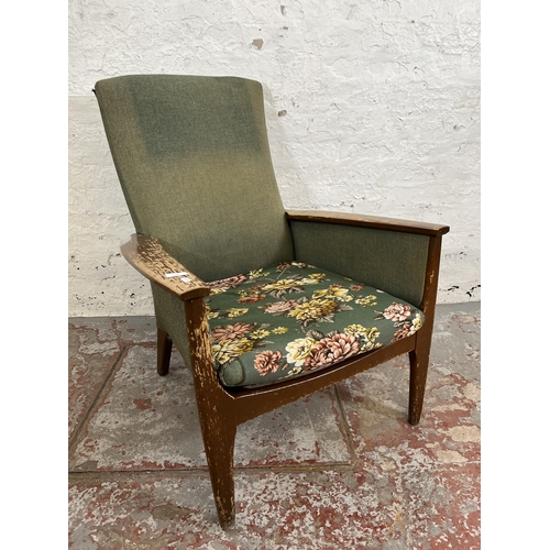 166 - A 1960s Parker Knoll PK988 beech and green fabric upholstered armchair