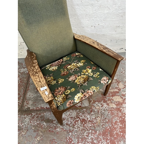 166 - A 1960s Parker Knoll PK988 beech and green fabric upholstered armchair