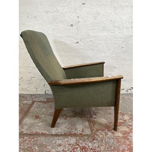 166 - A 1960s Parker Knoll PK988 beech and green fabric upholstered armchair