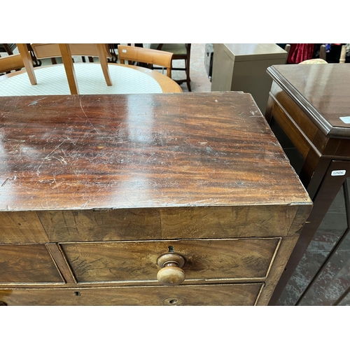 169 - A Victorian mahogany chest of two short over three long drawers