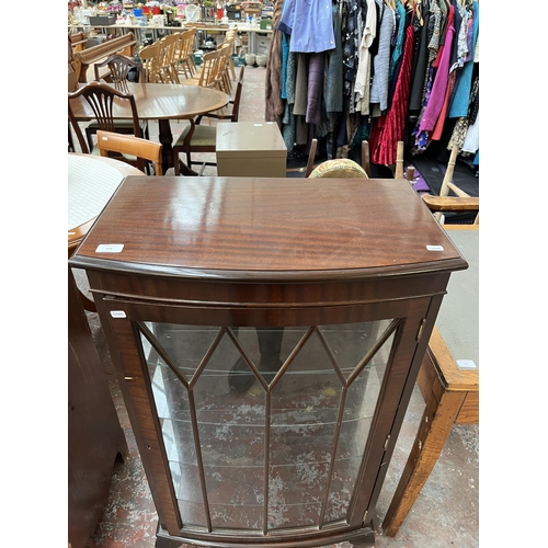 171 - A Georgian style mahogany bow front display cabinet with four glass shelves and cabriole supports