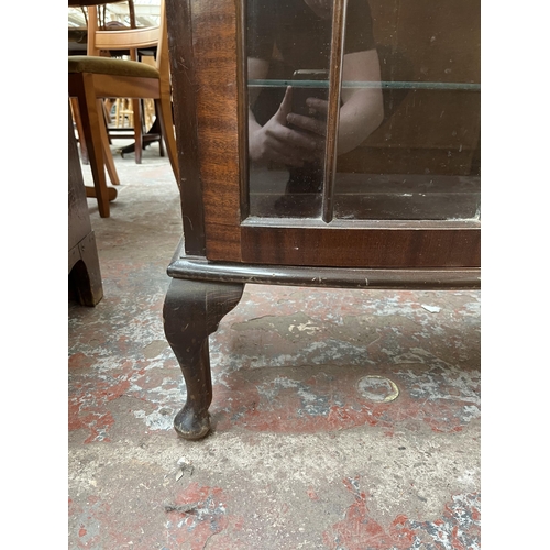 171 - A Georgian style mahogany bow front display cabinet with four glass shelves and cabriole supports