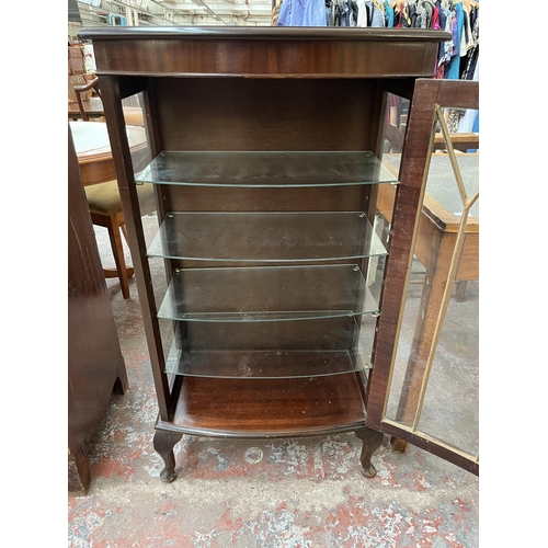 171 - A Georgian style mahogany bow front display cabinet with four glass shelves and cabriole supports