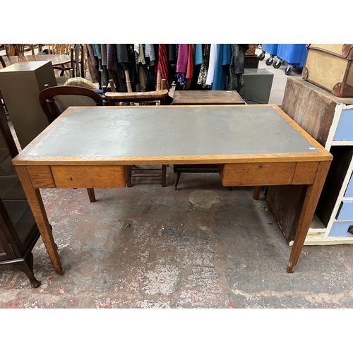 172 - A 1950s oak desk with grey painted writing surface, believed to be designed for the M.O.D.