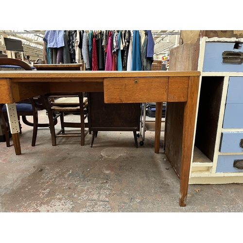 172 - A 1950s oak desk with grey painted writing surface, believed to be designed for the M.O.D.