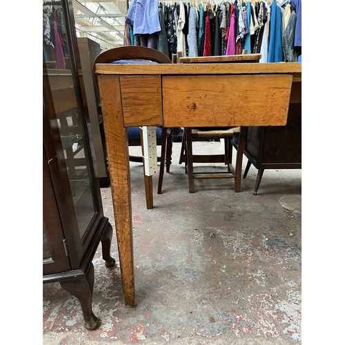 172 - A 1950s oak desk with grey painted writing surface, believed to be designed for the M.O.D.