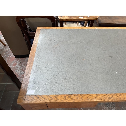 172 - A 1950s oak desk with grey painted writing surface, believed to be designed for the M.O.D.