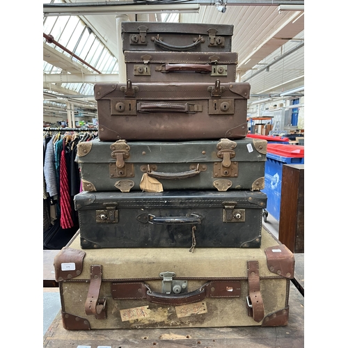 174 - Six early/mid 20th century suitcases