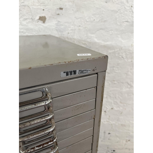 177 - A grey metal thirteen drawer office filing cabinet