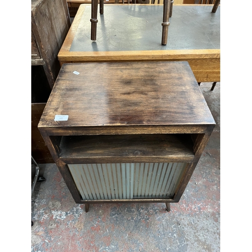 189 - A mid 20th century stained beech and plywood record cabinet with two glass sliding doors