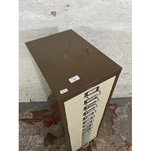 191 - A brown and cream metal fifteen drawer office filing cabinet