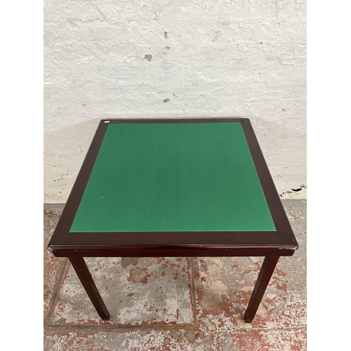 195 - A mahogany effect and green felt folding games table