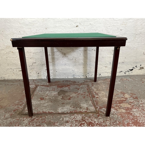 195 - A mahogany effect and green felt folding games table