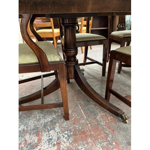 201 - A Lowe's of Loughborough Regency style mahogany and yew wood crossbanded triple pedestal extending D... 