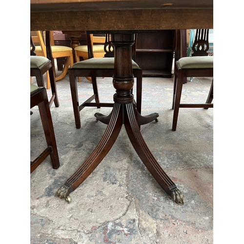 201 - A Lowe's of Loughborough Regency style mahogany and yew wood crossbanded triple pedestal extending D... 