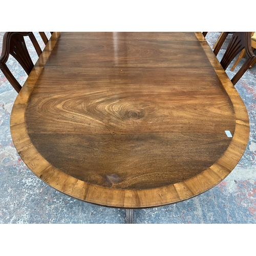 201 - A Lowe's of Loughborough Regency style mahogany and yew wood crossbanded triple pedestal extending D... 