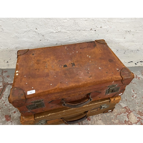 203 - Two early/mid 20th century brown leather suitcases