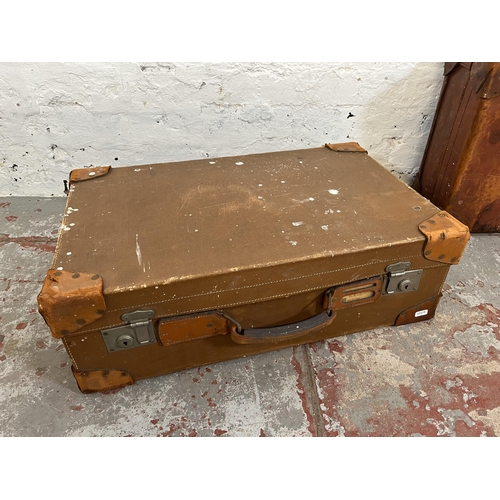 203 - Two early/mid 20th century brown leather suitcases