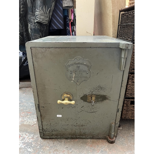 204 - A Withy Grove Stores Ltd. Manchester bent steel safe with key