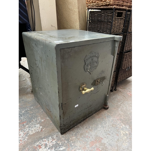 204 - A Withy Grove Stores Ltd. Manchester bent steel safe with key