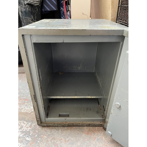 204 - A Withy Grove Stores Ltd. Manchester bent steel safe with key