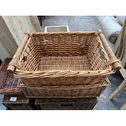 205 - Five wicker items, three baskets and two chests of drawers