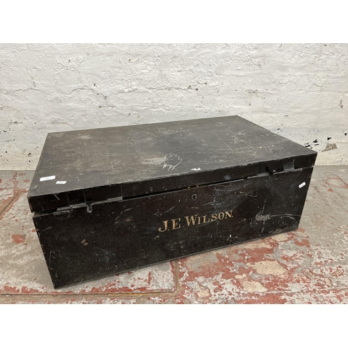 207 - An early 20th century black metal travel trunk