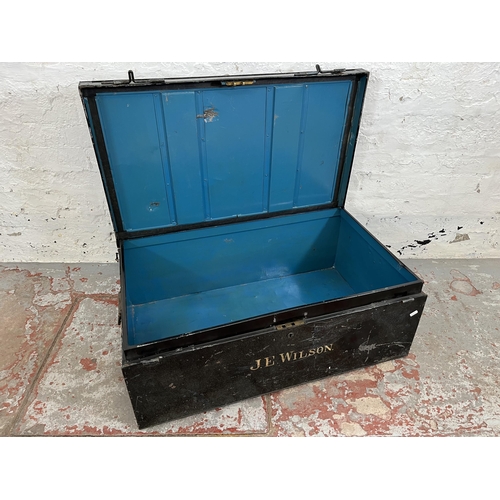 207 - An early 20th century black metal travel trunk