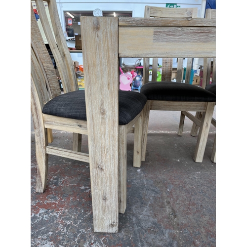 209 - A modern hardwood rectangular dining table and four matching chairs - approx. 77cm high x 80cm wide ... 