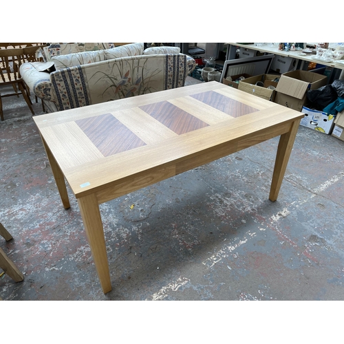 209A - A modern oak rectangular dining table - approx. 75cm high x 90cm wide x 150cm long