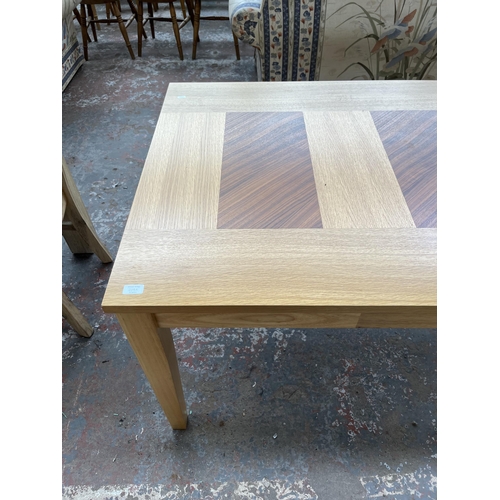 209A - A modern oak rectangular dining table - approx. 75cm high x 90cm wide x 150cm long