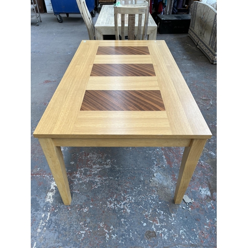 209A - A modern oak rectangular dining table - approx. 75cm high x 90cm wide x 150cm long