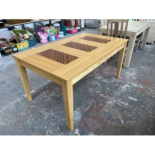 209A - A modern oak rectangular dining table - approx. 75cm high x 90cm wide x 150cm long