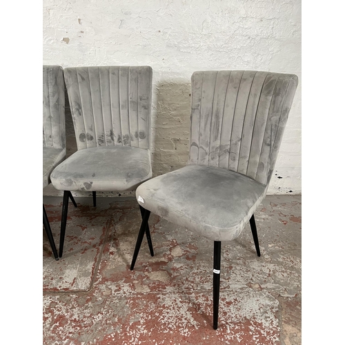 67 - A set of four Dunelm grey fabric upholstered dining chairs with black metal splayed supports