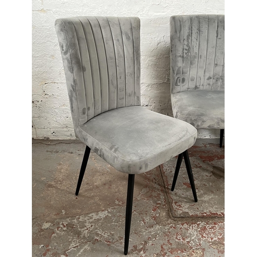 67 - A set of four Dunelm grey fabric upholstered dining chairs with black metal splayed supports