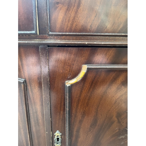 69 - A Georgian style mahogany sideboard with three drawers and three cupboard doors