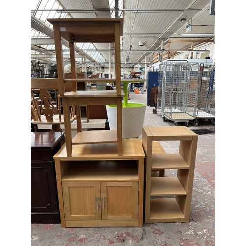 70 - Four pieces of modern oak effect furniture, two side tables, one TV stand and one shelving unit