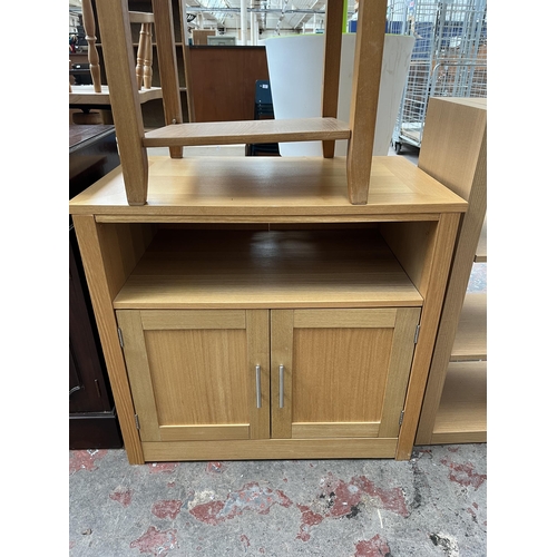 70 - Four pieces of modern oak effect furniture, two side tables, one TV stand and one shelving unit