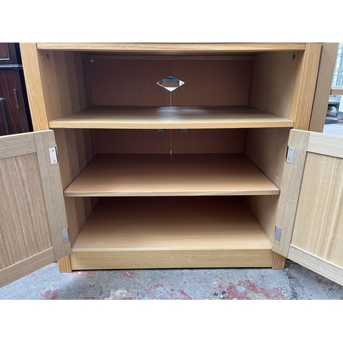 70 - Four pieces of modern oak effect furniture, two side tables, one TV stand and one shelving unit