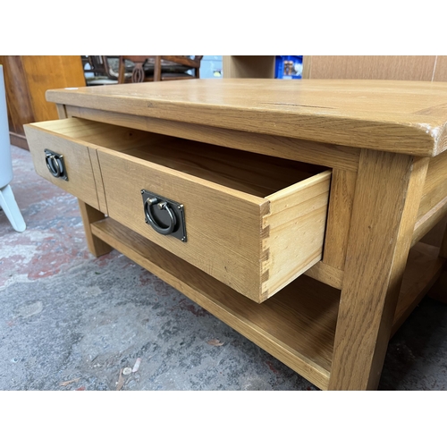 72 - A modern oak rectangular two tier coffee table with single drawer - approx. 47cm high x 90cm wide x ... 