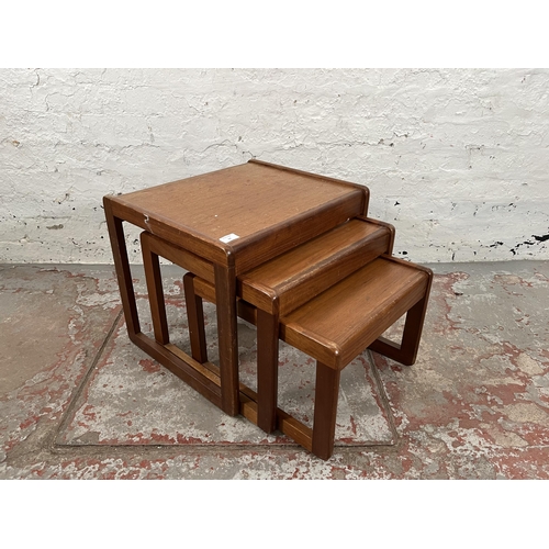 74 - A teak nest of three tables