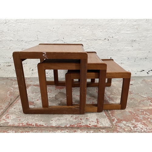 74 - A teak nest of three tables