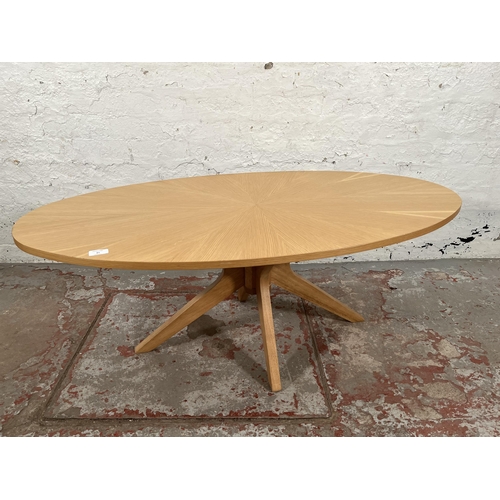 81 - A Scandinavian style oak sunburst pattern oval coffee table