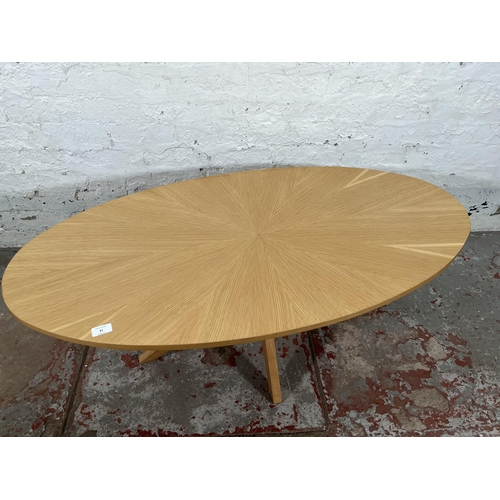 81 - A Scandinavian style oak sunburst pattern oval coffee table