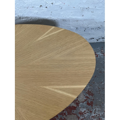 81 - A Scandinavian style oak sunburst pattern oval coffee table