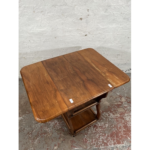 83 - A 1960s Tenax Manchester walnut drop leaf three tier tea trolley